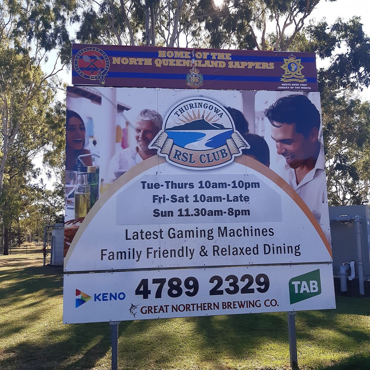 Roadside sign of the Thuringowa RSL Club advertising gaming machines, keno and TAB
